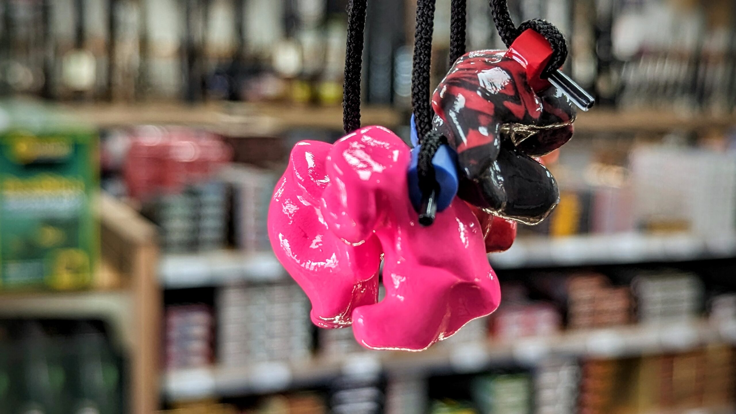 Colorful Custom Ear Plugs hanging on their respective strings