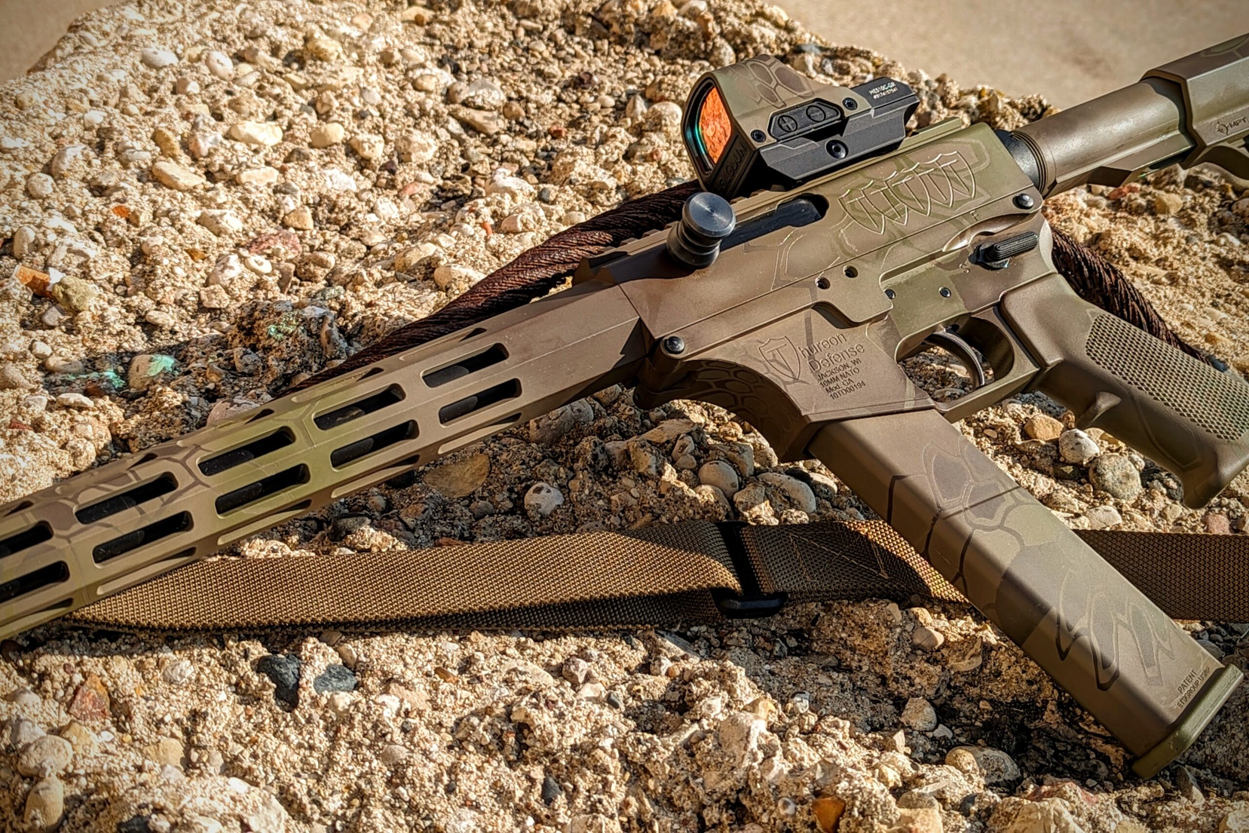 Thureon Defense painted Cerakote in a Kryptek pattern with magpul FDE, Chocolate Brown, and Forest Green